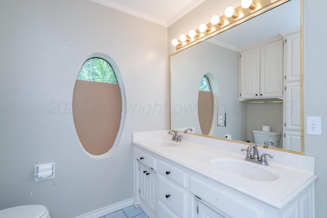 3501 Van Winkle Dr, Amarillo, TX 79121 - bathroom featuring toilet, baseboards, double vanity, ornamental molding, and tile patterned flooring