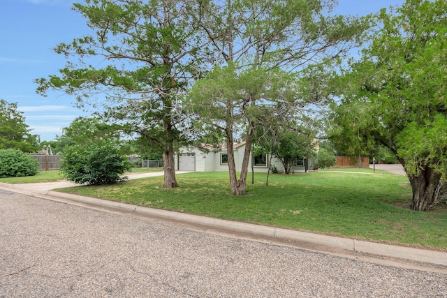 1805 Broadmoor St, Amarillo, TX 79106 - obstructed view of property with an attached garage and driveway