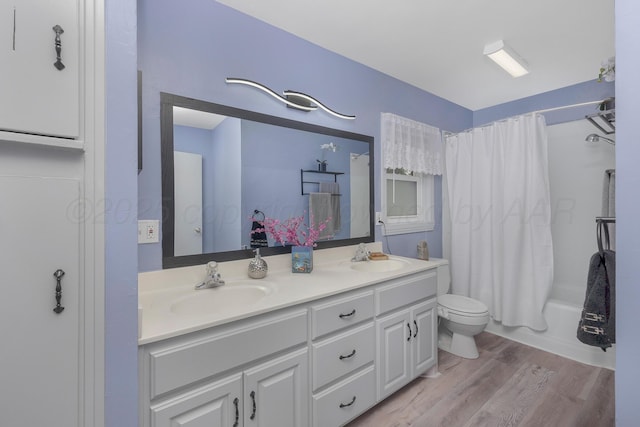 1805 Broadmoor St, Amarillo, TX 79106 - bathroom featuring double vanity, shower / bath combo with shower curtain, and wood finished floors