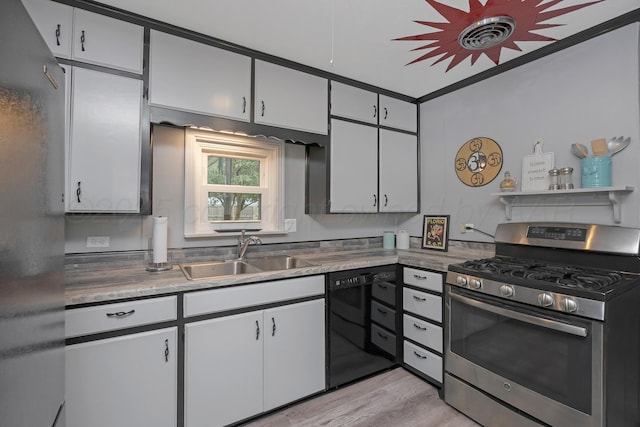 1805 Broadmoor St, Amarillo, TX 79106 - kitchen with gas range, black dishwasher, light wood-style flooring, white cabinets, and crown molding