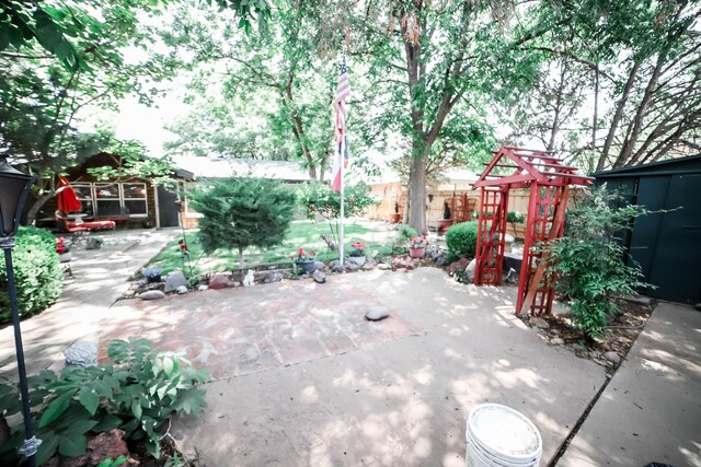 4204 Harmony St, Amarillo, TX 79109 - view of patio with an outbuilding