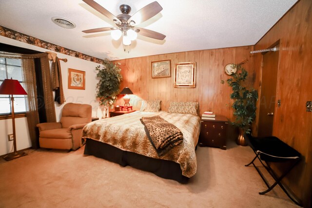4204 Harmony St, Amarillo, TX 79109 - bedroom with carpet flooring, wooden walls, ceiling fan, and a textured ceiling