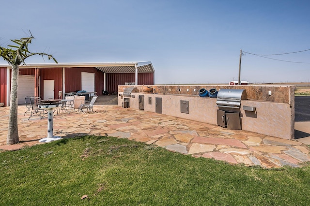 exterior space with area for grilling and an outdoor fire pit