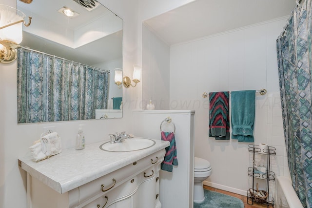 bathroom with wood-type flooring, vanity, toilet, and ornamental molding