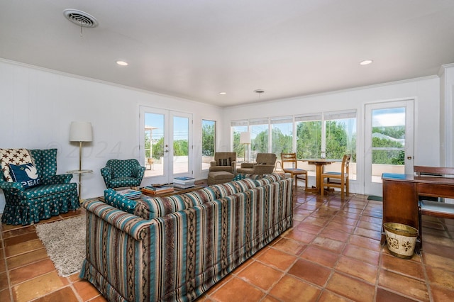 living room featuring tile patterned floors, french doors, and ornamental molding