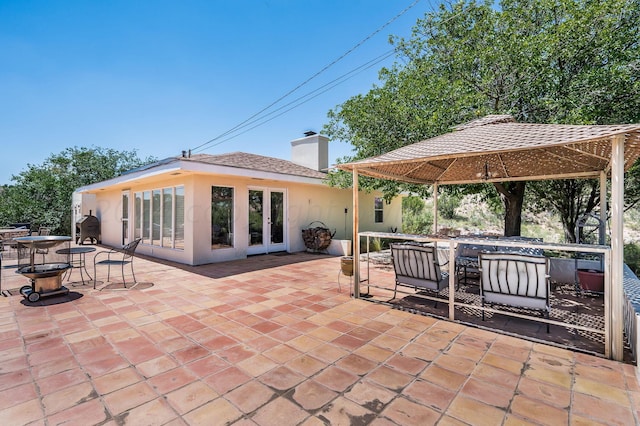 view of patio / terrace featuring a gazebo and french doors