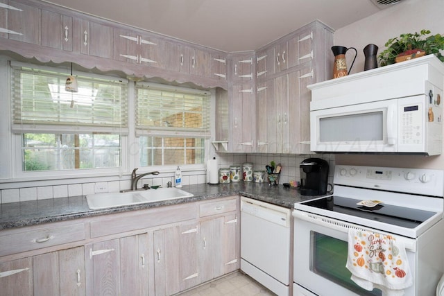 3406 Meadow Dr, Amarillo, TX 79109 - kitchen featuring white appliances and decorative backsplash