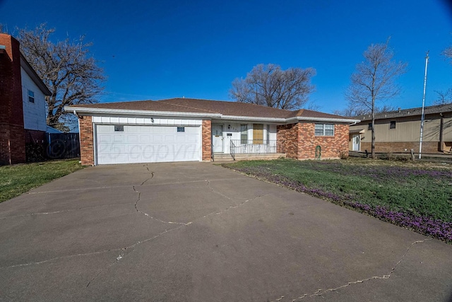2230 Laurel St, Amarillo, TX 79109 - ranch-style home with brick siding, a front yard, covered porch, a garage, and driveway