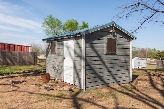 view of shed with fence