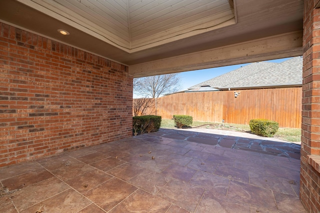 view of patio / terrace featuring fence