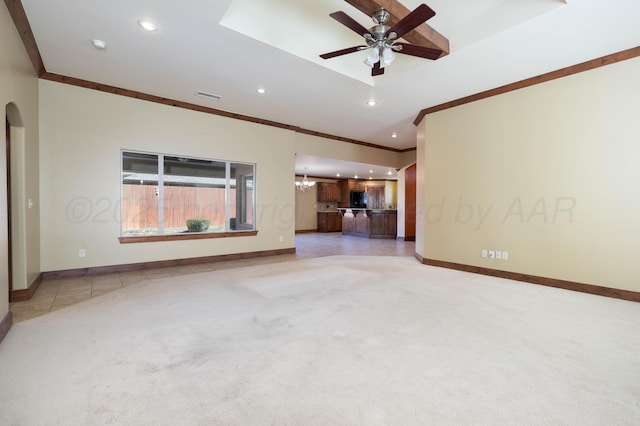 interior space featuring light carpet, visible vents, baseboards, and ornamental molding