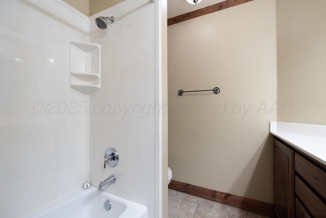 bathroom with vanity, shower / bathing tub combination, toilet, and baseboards