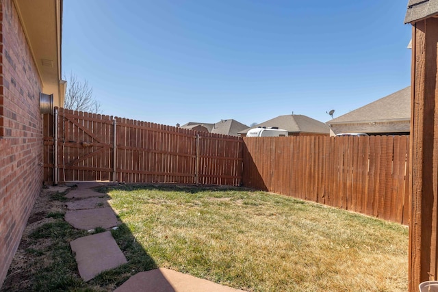 view of yard with a fenced backyard