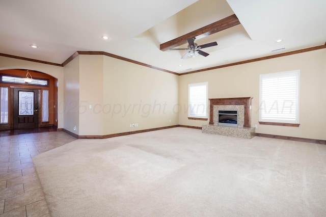 unfurnished living room featuring visible vents, carpet flooring, and baseboards