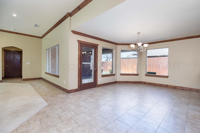 unfurnished room featuring visible vents, baseboards, a chandelier, ornamental molding, and arched walkways