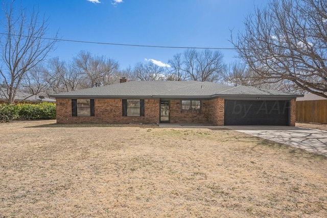 ranch-style home with brick siding, an attached garage, fence, driveway, and a front lawn