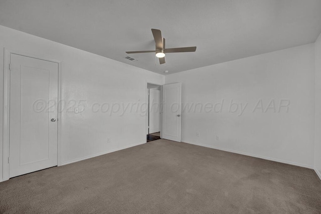 unfurnished bedroom featuring baseboards, carpet, visible vents, and a ceiling fan