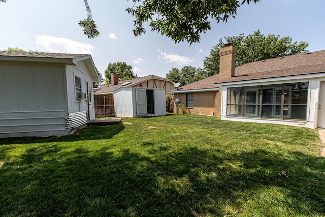 view of yard with cooling unit and a shed