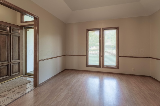 spare room featuring light wood-type flooring