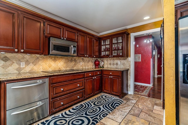 1204 University Pl, Borger, TX 79007 - kitchen with stainless steel microwave, black electric cooktop, stone tile flooring, a warming drawer, and tasteful backsplash