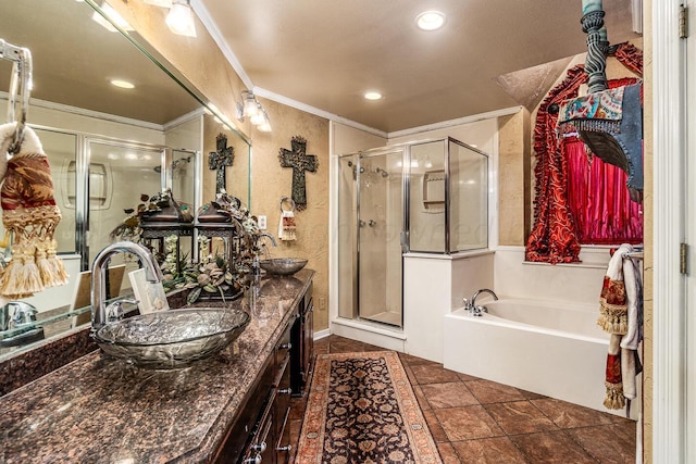 1204 University Pl, Borger, TX 79007 - bathroom with crown molding, double vanity, a shower stall, a bath, and recessed lighting