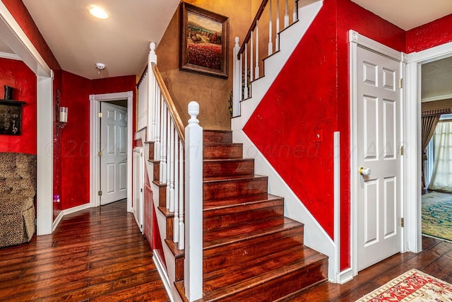 1204 University Pl, Borger, TX 79007 - stairway featuring hardwood / wood-style floors, baseboards, and recessed lighting