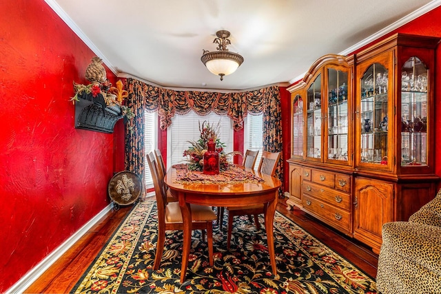 1204 University Pl, Borger, TX 79007 - dining space with wood finished floors, crown molding, and baseboards