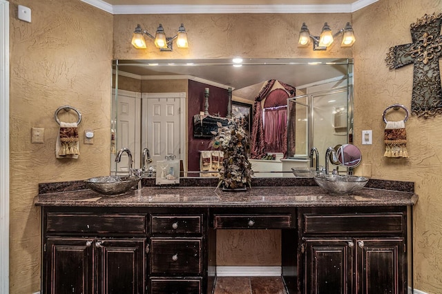 1204 University Pl, Borger, TX 79007 - full bath featuring a textured wall, double vanity, a stall shower, and ornamental molding