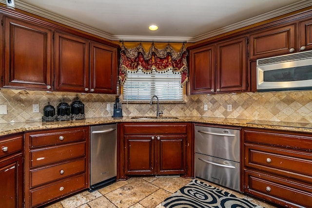 1204 University Pl, Borger, TX 79007 - kitchen featuring stainless steel appliances, a sink, decorative backsplash, light stone finish floors, and ornamental molding