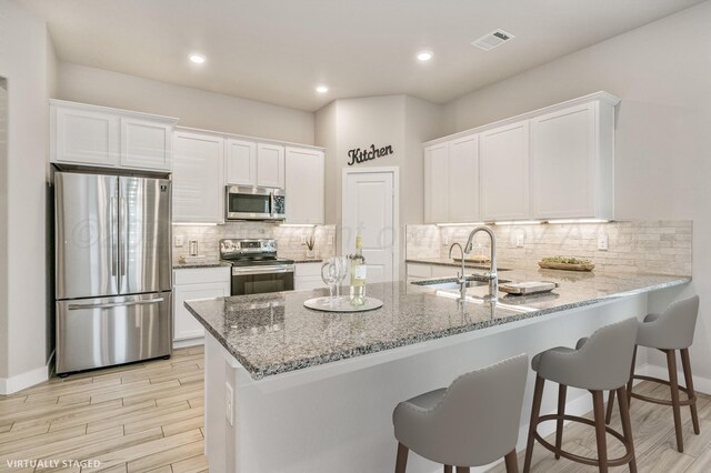 9209 Lexford Dr, Amarillo, TX 79119 - full bathroom featuring a bath, a stall shower, and wood finished floors
