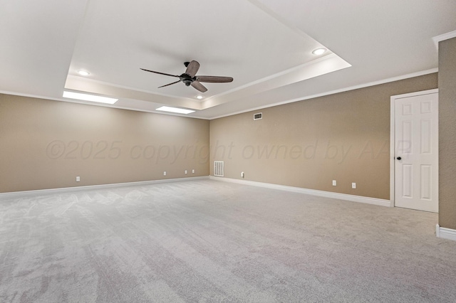 7723 Stuyvesant Ave, Amarillo, TX 79121 - carpeted spare room with a tray ceiling, a ceiling fan, recessed lighting, crown molding, and baseboards