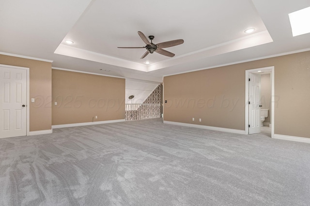 7723 Stuyvesant Ave, Amarillo, TX 79121 - empty room featuring a tray ceiling, a ceiling fan, carpet floors, recessed lighting, and ornamental molding