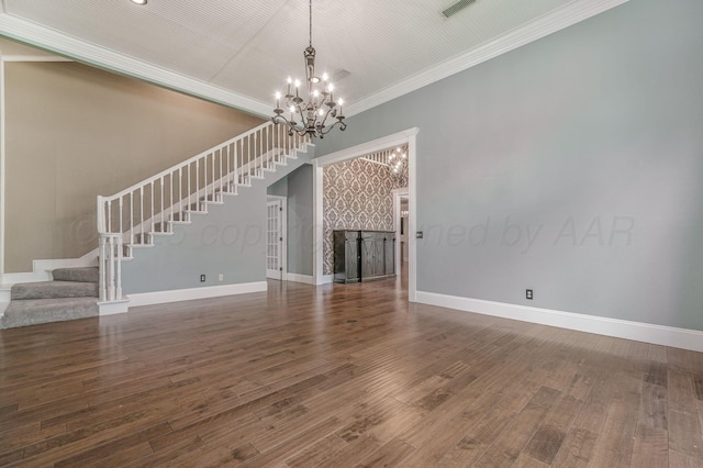 7723 Stuyvesant Ave, Amarillo, TX 79121 - unfurnished living room with a chandelier, stairs, crown molding, baseboards, and wood finished floors