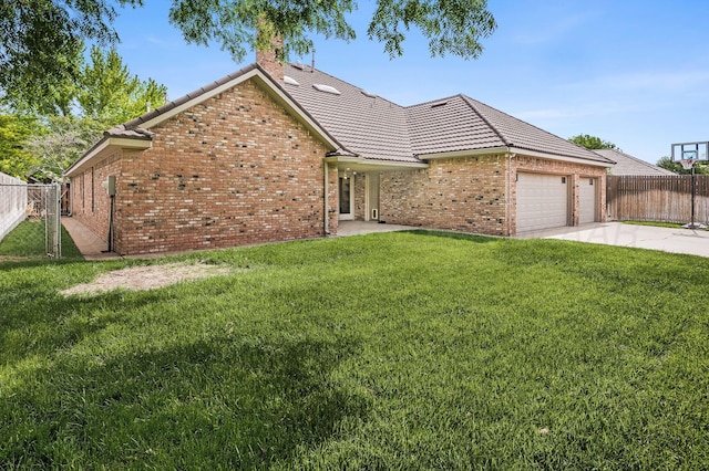 7723 Stuyvesant Ave, Amarillo, TX 79121 - view of front of house with a garage, a tiled roof, brick siding, and concrete driveway