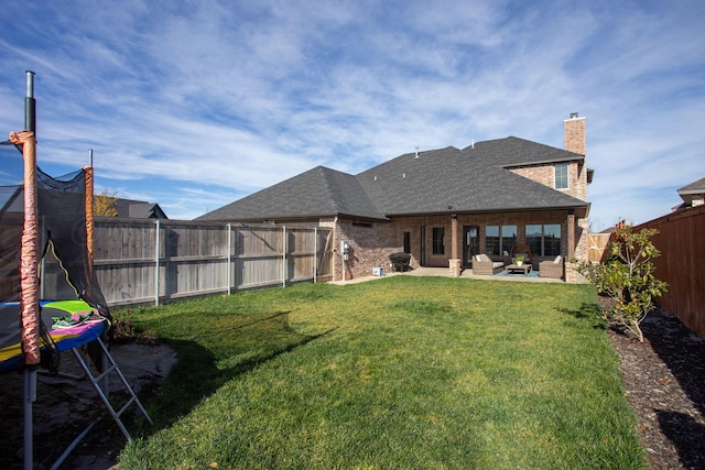 5609 Hollow Landing Ave, Amarillo, TX 79118 - view of yard featuring a patio area, an outdoor hangout area, and a trampoline
