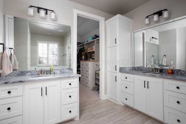 5609 Hollow Landing Ave, Amarillo, TX 79118 - full bathroom featuring two vanities and a walk in closet