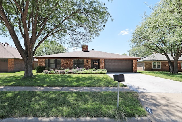 ranch-style house with a garage and a front lawn