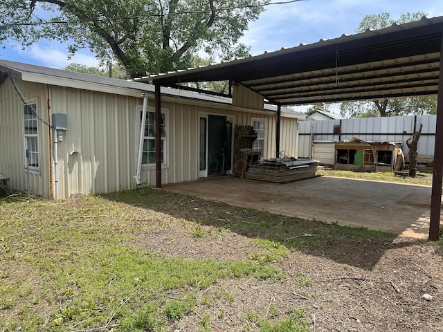 316 SE 21st Ave, Amarillo, TX 79109 - exterior space with board and batten siding, a patio, fence, and a carport