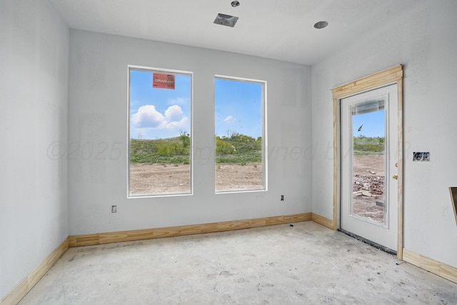 spare room featuring baseboards