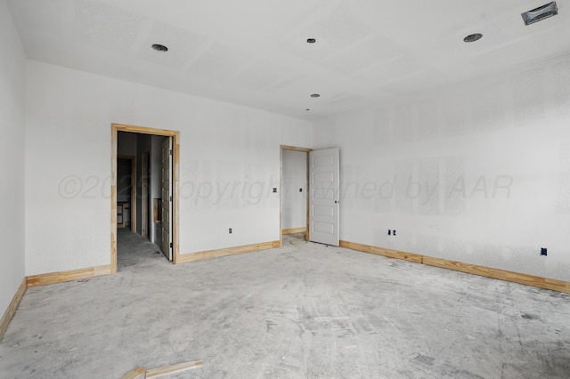 empty room featuring baseboards