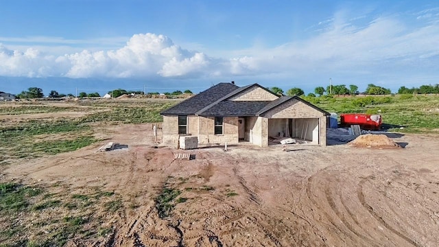 view of front of home featuring a rural view
