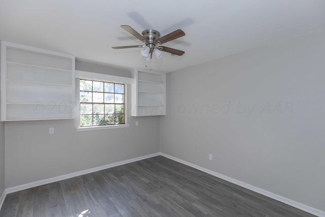 empty room featuring ceiling fan and dark hardwood / wood-style flooring