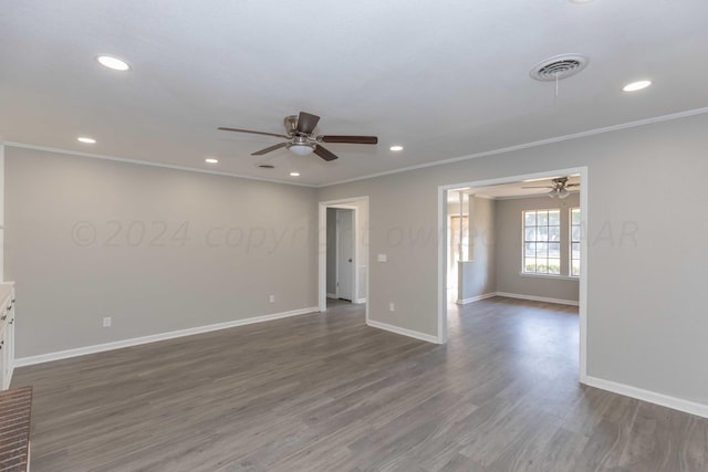 empty room with dark wood-type flooring, ceiling fan, and ornamental molding