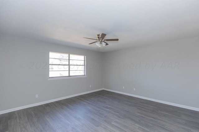 spare room featuring ceiling fan and dark hardwood / wood-style floors