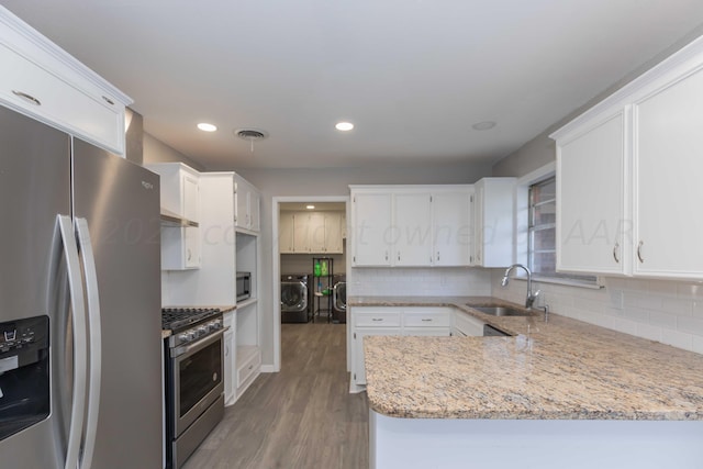 kitchen featuring white cabinets and appliances with stainless steel finishes