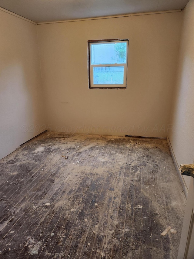 empty room with hardwood / wood-style flooring