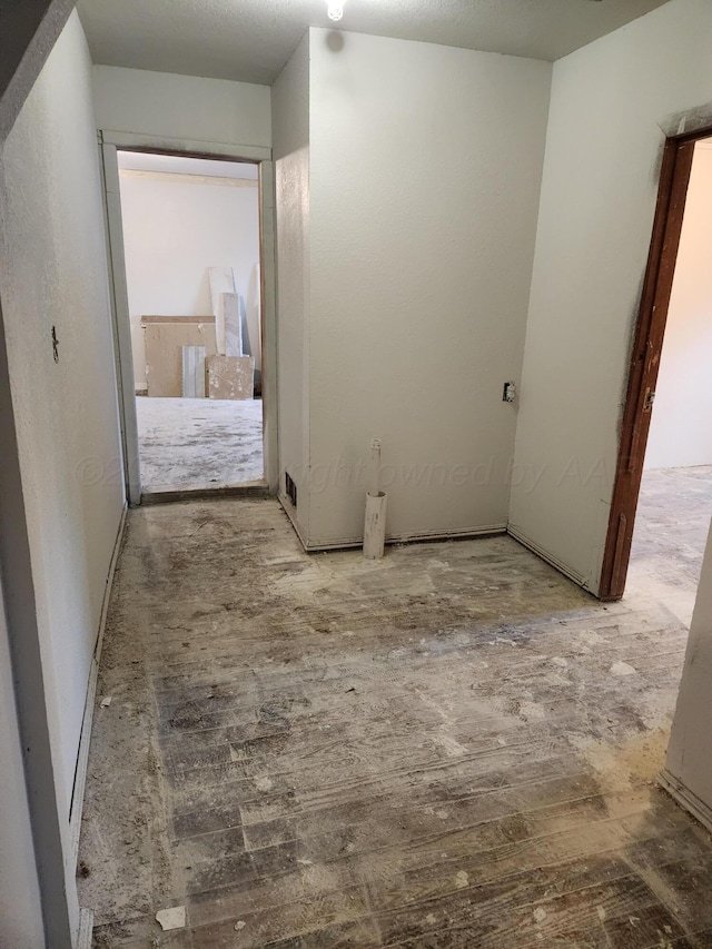 hallway with wood finished floors