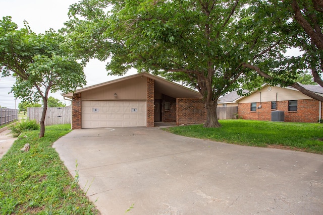 4818 SE 33rd Ave, Amarillo, TX 79103 - view of front of property with concrete driveway, brick siding, and an attached garage