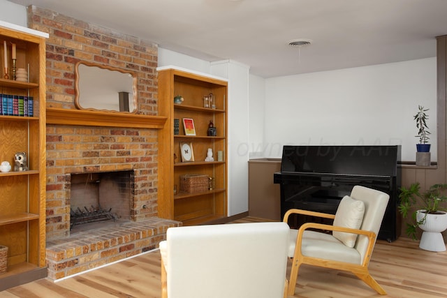 4818 SE 33rd Ave, Amarillo, TX 79103 - living room with a brick fireplace and wood finished floors