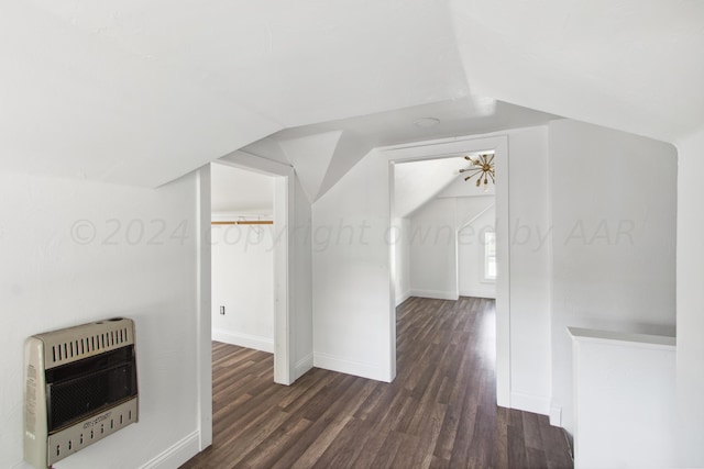 818 N Someville St, Pampa, TX 79065 - bonus room with heating unit, baseboards, vaulted ceiling, and wood finished floors